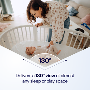 Nanit Flex Stand delivers as 130° view of almost any sleep or play space. Mom looking at baby who is in crib