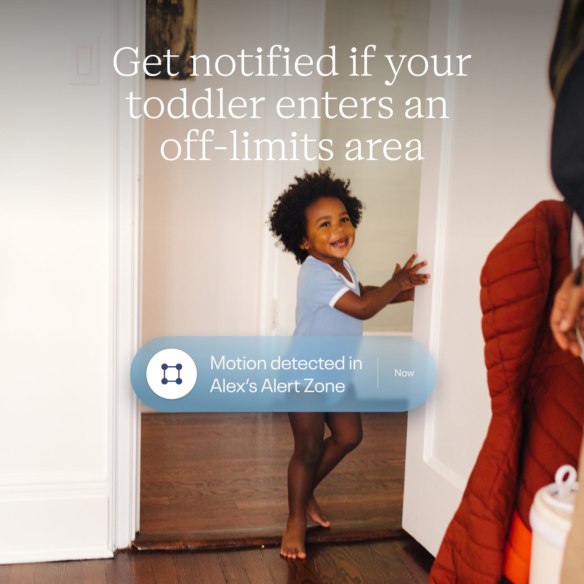 Child standing in a doorway with a notification about motion detection in an 'off-limits area'.