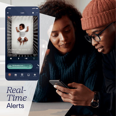 Parents checking Nanit app showing live screen of their baby and shows real-time alerts