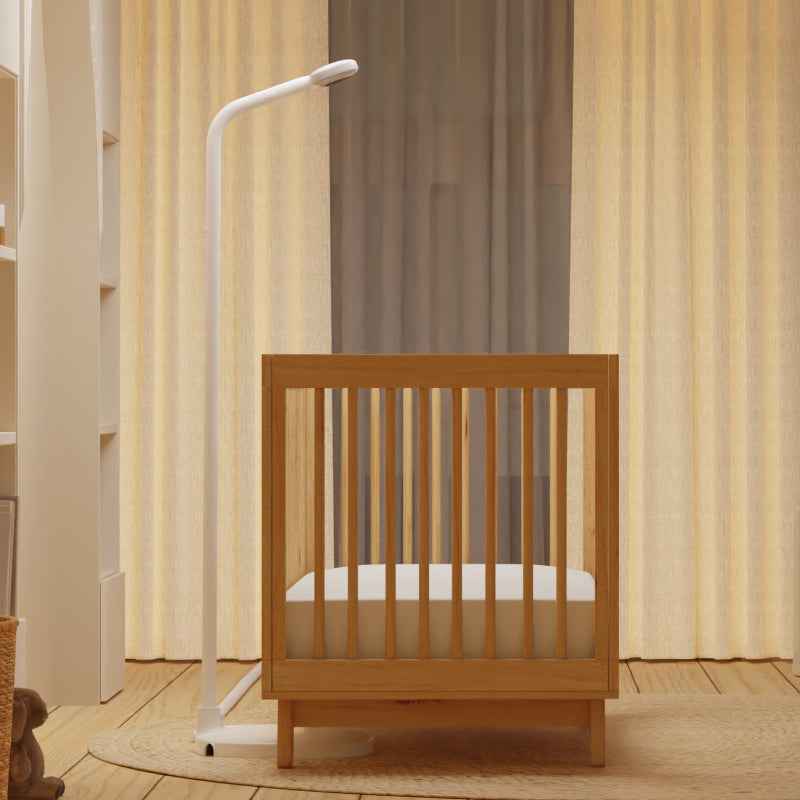 nanit pro baby monitor + floor stand set up next to crib in nursery #mount_floor stand