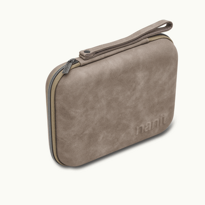 angled image of greige travel case
