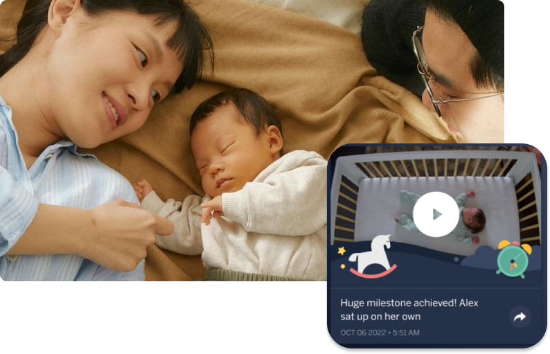 Mom and dad with baby with a display of Nanit app with video of baby sleeping
