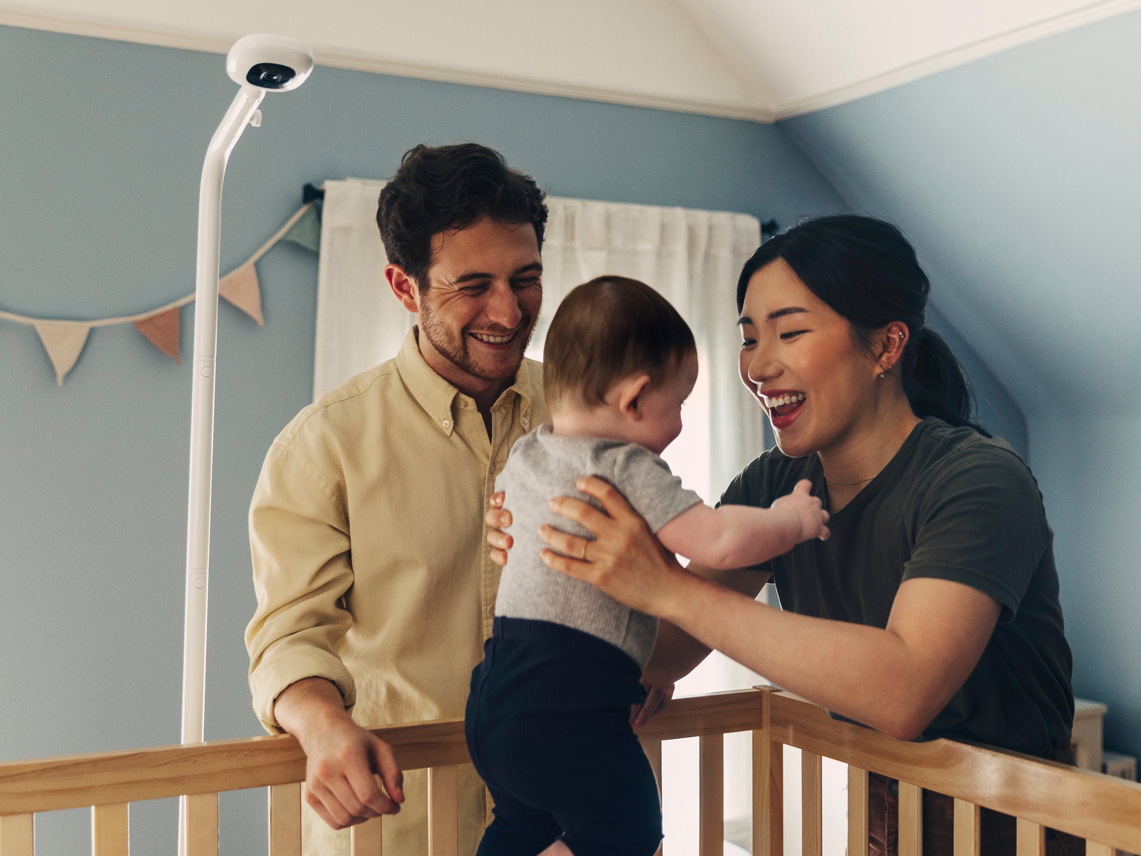 Family in a nursery with a baby