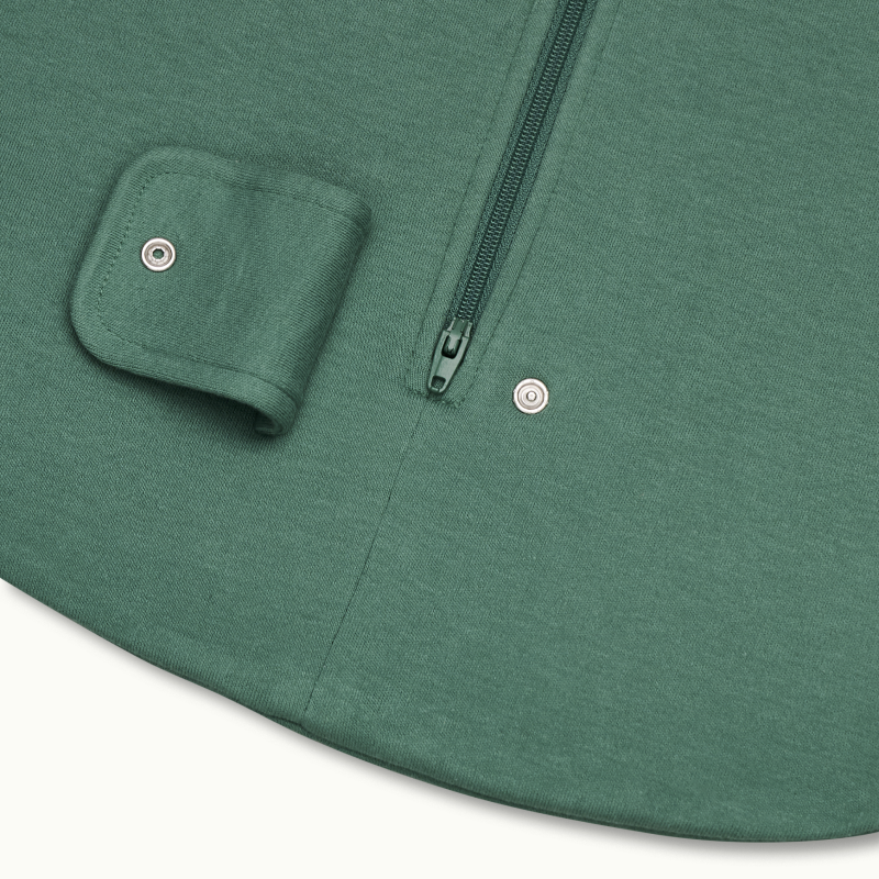 zoomed in on two-way bottom zipper on sleeping bag in spruce green #color_spruce green
