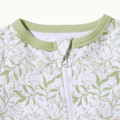 zoomed in on front view of pajama protective chin zipper guard in leafy canopy