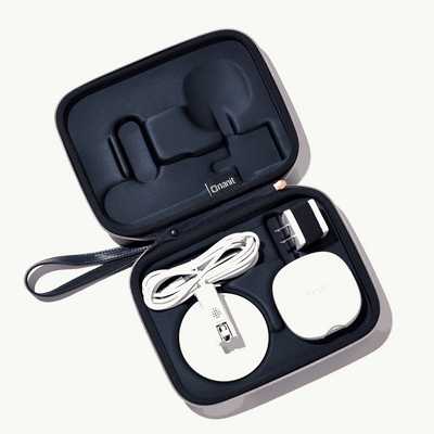 inside nanit travel case in abstract stripe with nanit pro camera, flex stand, and power adapter
