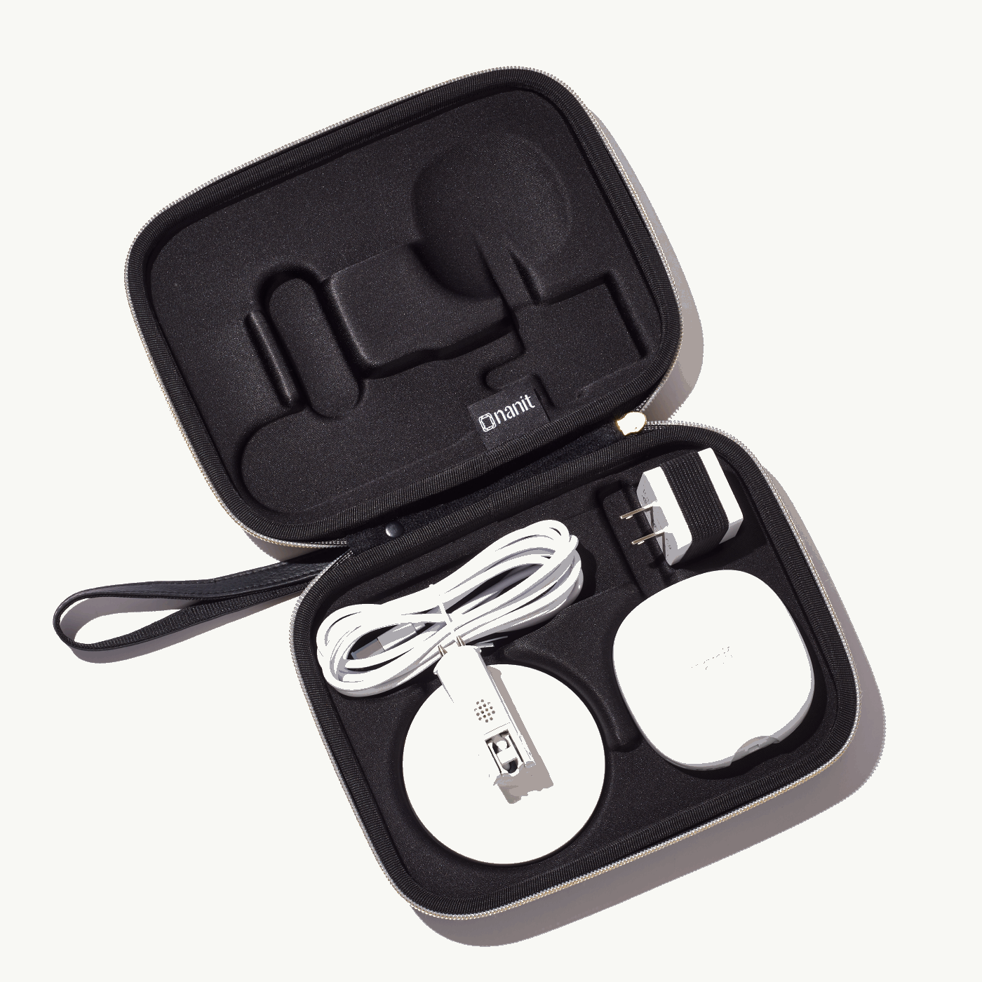 inside nanit travel case in black with nanit pro camera, flex stand, and power adapter #color_black