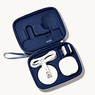 inside nanit travel case in blue with nanit pro camera, flex stand, and power adapter