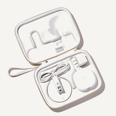 inside nanit travel case in marble with nanit pro camera, flex stand, and power adapter