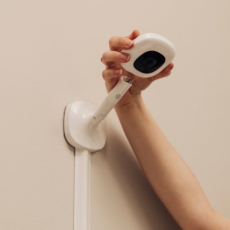 Image of attaching nanit pro camera on wall mount with wall mount mounted on the wall #mount_wall mount