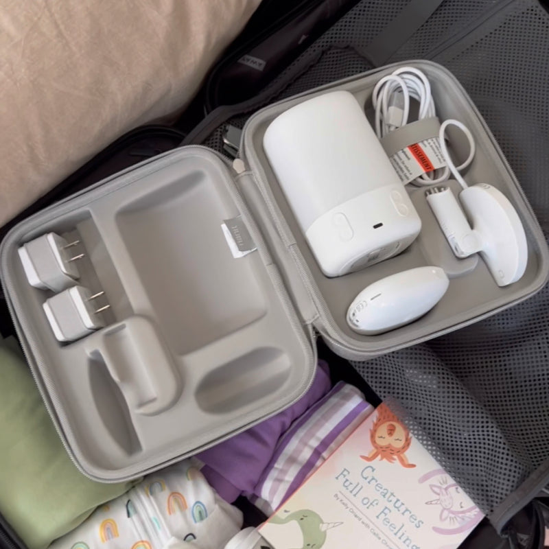Traveling Light Case opened with Sound + Light Machine, Nanit Pro Camera, and Flex Stand inside