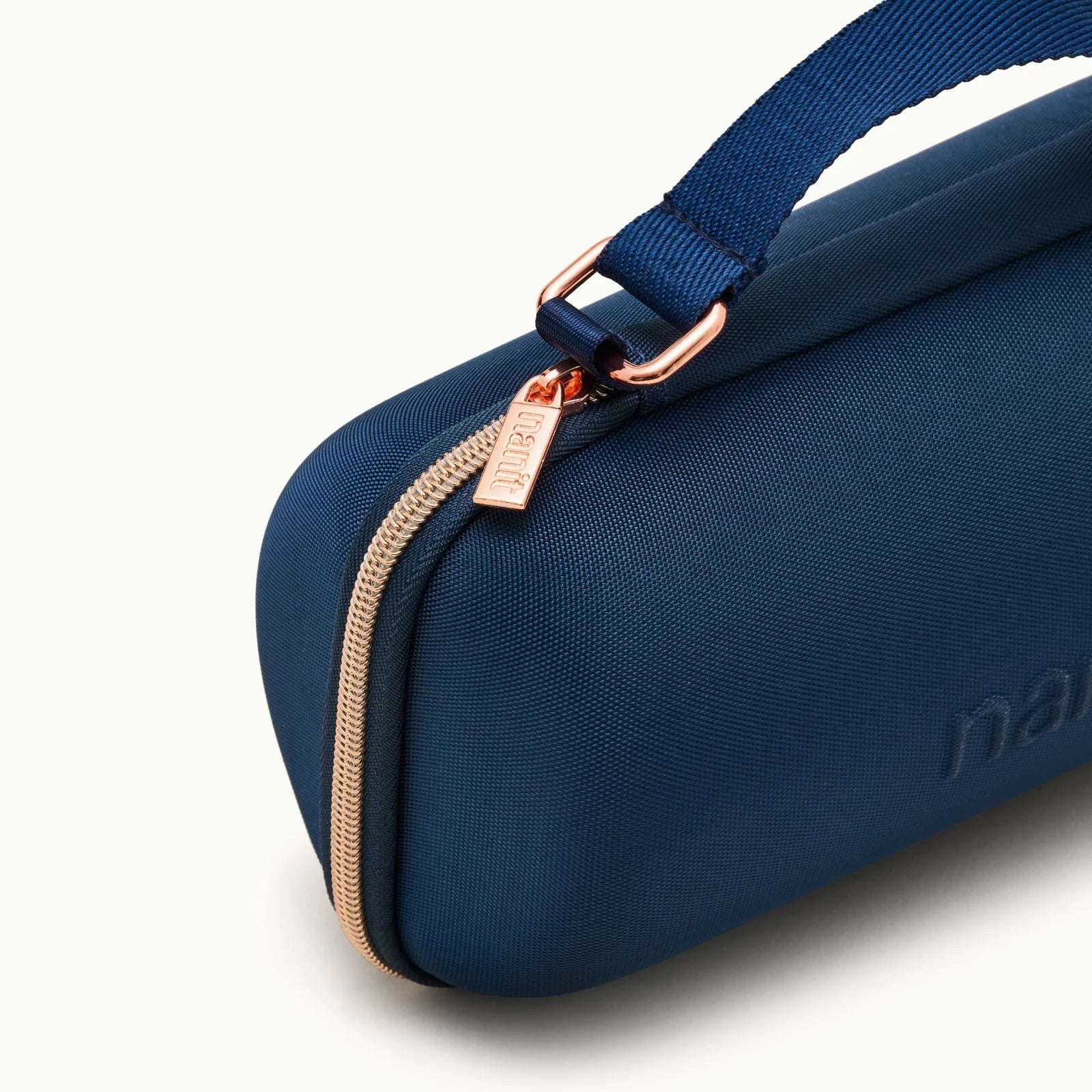 angled view of Nanit Sound + Light Travel Case #color_blue oxford