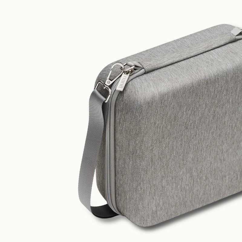 Angled shot of Nanit Traveling Light Case in heather gray oxford #color_heather gray oxford