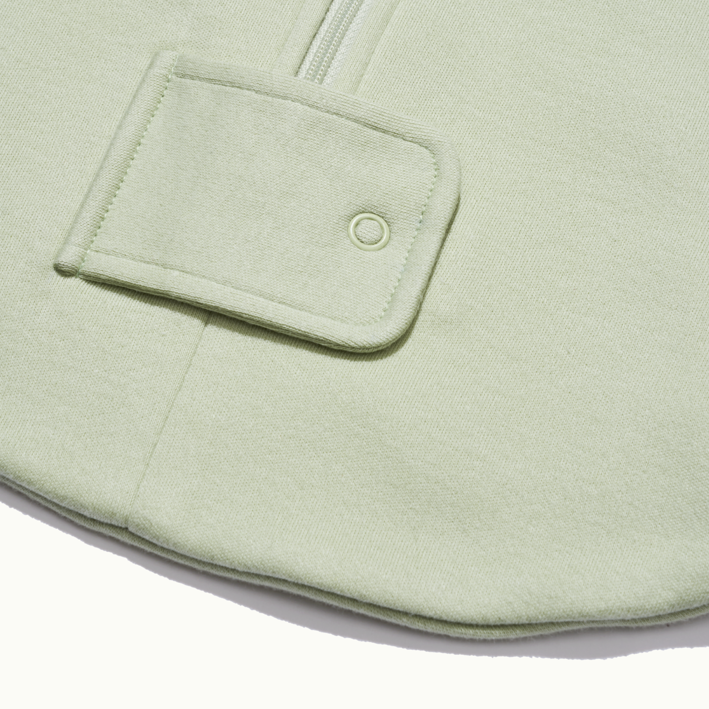 zoomed in on two-way bottom zipper on sleeping bag in pistachio #color_pistachio