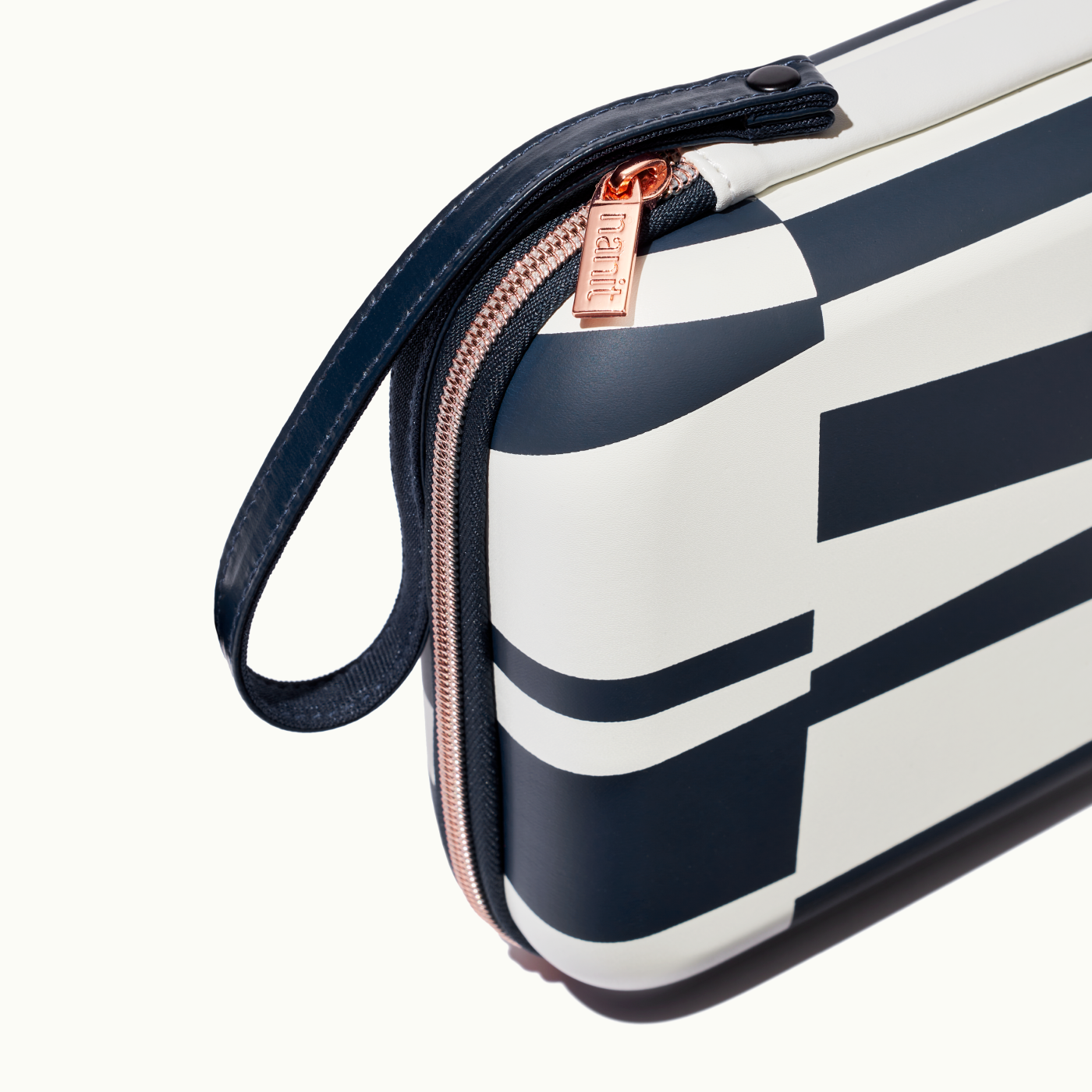 zoomed in picture of rose pink zipper and strap on abstract stripe travel case #color_abstract stripe