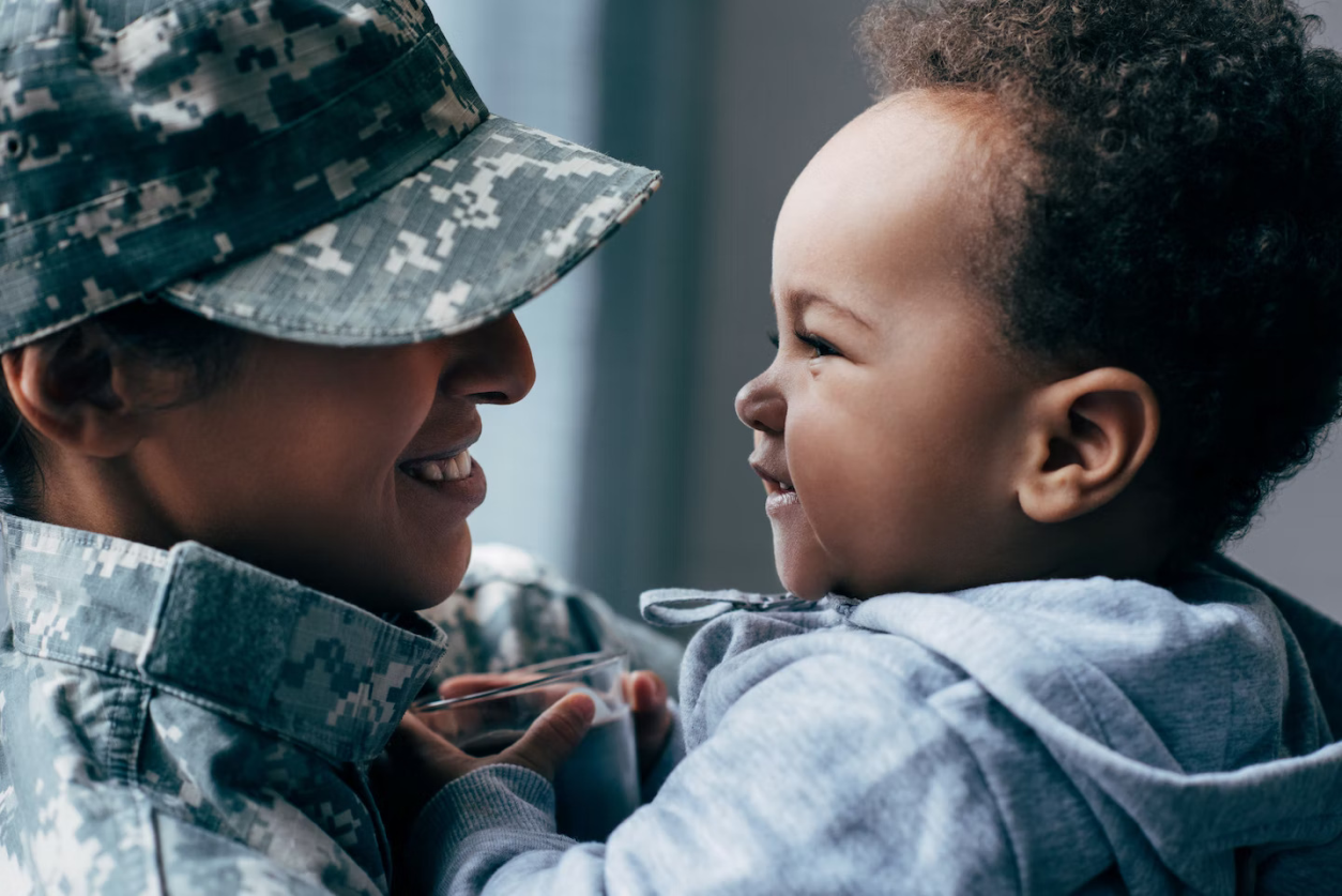 military parent and child smiling together