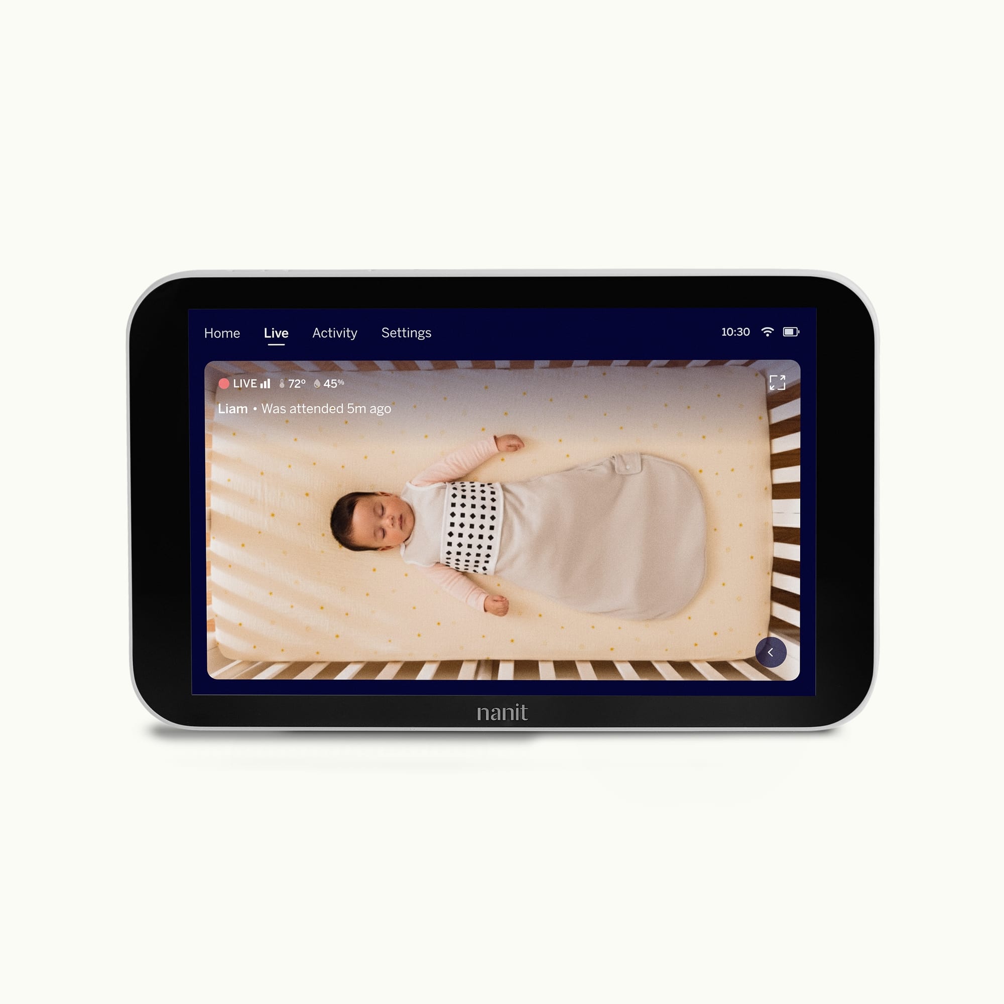 Nanit Home displaying a baby lying on a bed