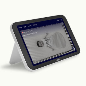 Nanit Home displaying a baby in a crib with night vision