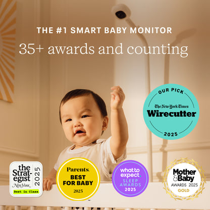 Baby standing with text about smart baby monitor awards and a Wirecutter badge.