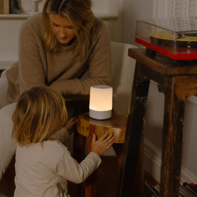 mom with kid while kid looks at nanit sound + light