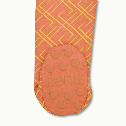 zoomed in on right feet in front view of sleep wear pajamas in go between showing signature foot gripper 