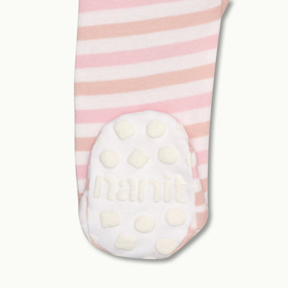 zoomed in on right feet in front view of sleep wear pajamas in rose pink stripe showing signature foot gripper 