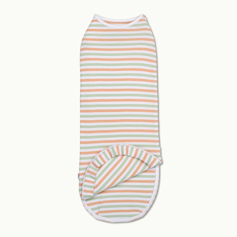 nanit sleeping wear swaddle in apricot bold stripe and showing inside #color_apricot bold stripe