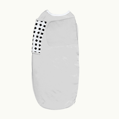 back side of nanit swaddle in gray 