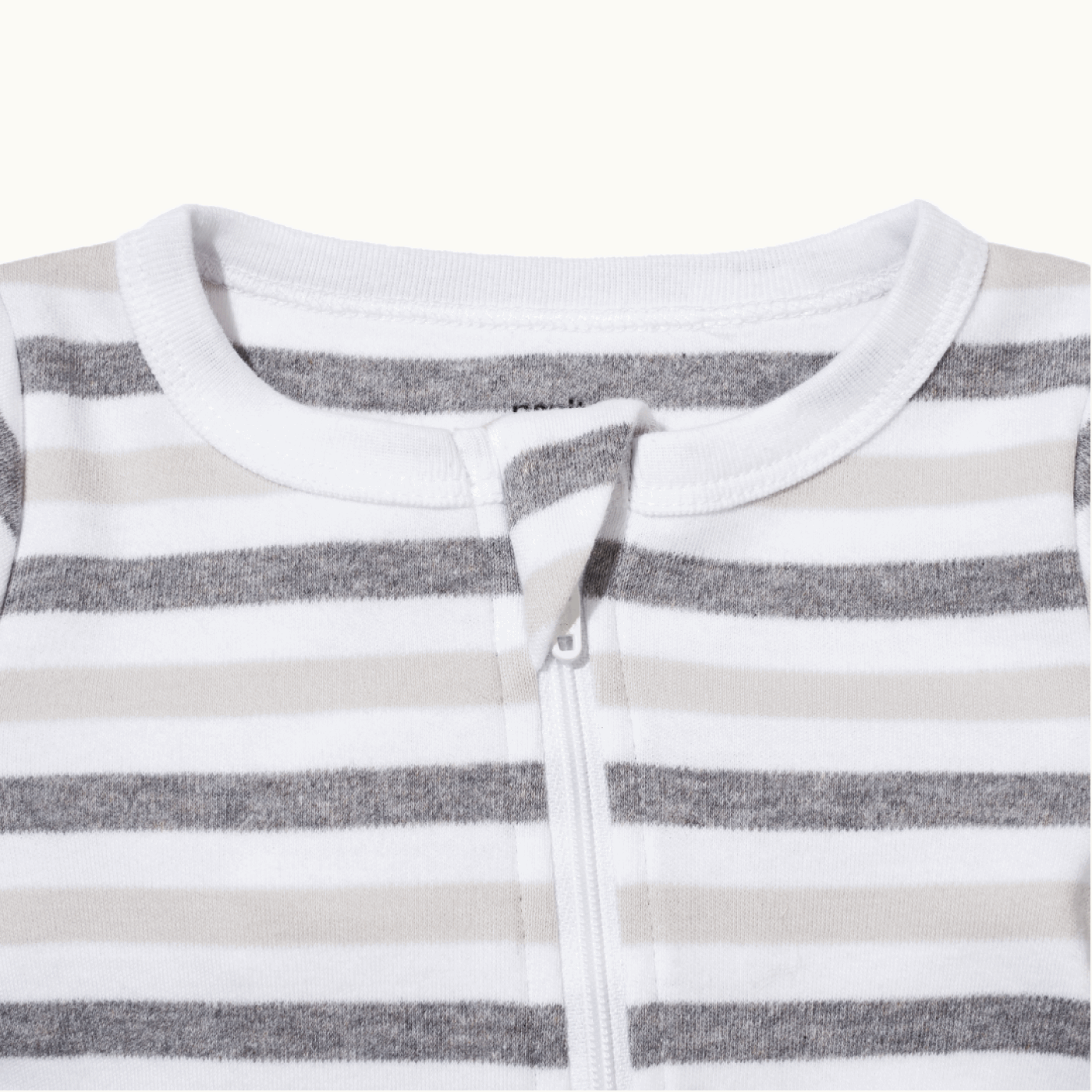 zoomed in on front view of pajama protective chin zipper guard in bold stripe #color_bold stripe