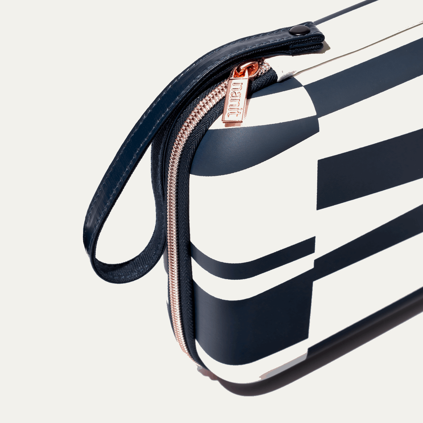 zoomed in picture of rose pink zipper and strap on abstract stripe travel case #color_abstract stripe