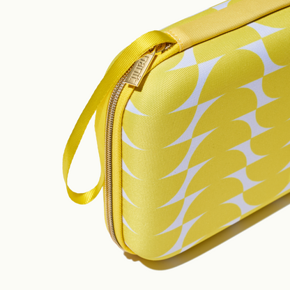 zoomed in picture of gold zipper and strap on yellow travel case 