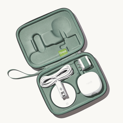 inside nanit travel case in green with nanit pro camera, flex stand, and power adapter 