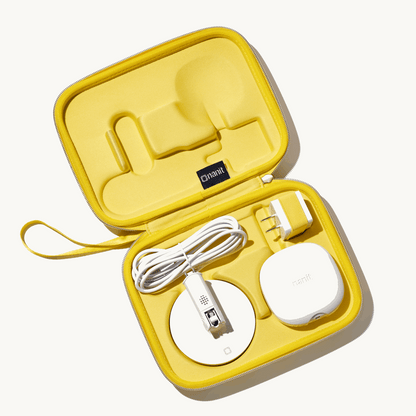 inside nanit travel case in yellow with nanit pro camera, flex stand, and power adapter 