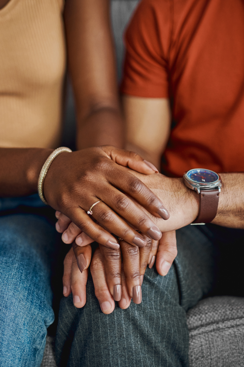 couple holding hand with up close view