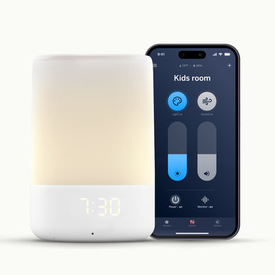 Nanit Sound + Light Machine next to Nanit Sound + Light App showing light and sound control on phone