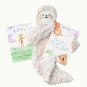 affirmation card, sloth snuggler, and Creatures Full of Feelings book