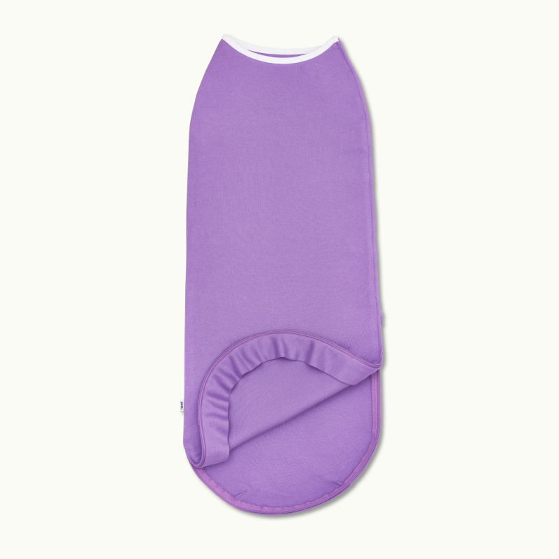 nanit sleeping wear swaddle in violet and showing inside #color_violet