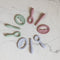 birds eye view of ezpz oral development tools in sage, blush, and pewter