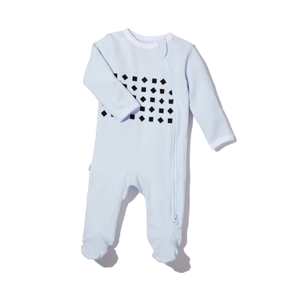 right arm sleeve folded and pajama showing in blue 