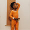 Toddler wearing Nanit Sleep Wear Pajamas in Go Between color