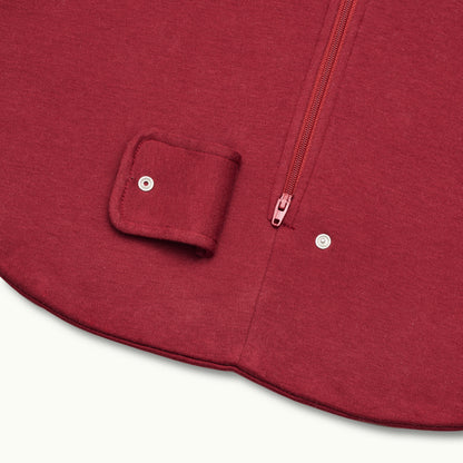 zoomed in on two-way bottom zipper on sleeping bag in burgundy 