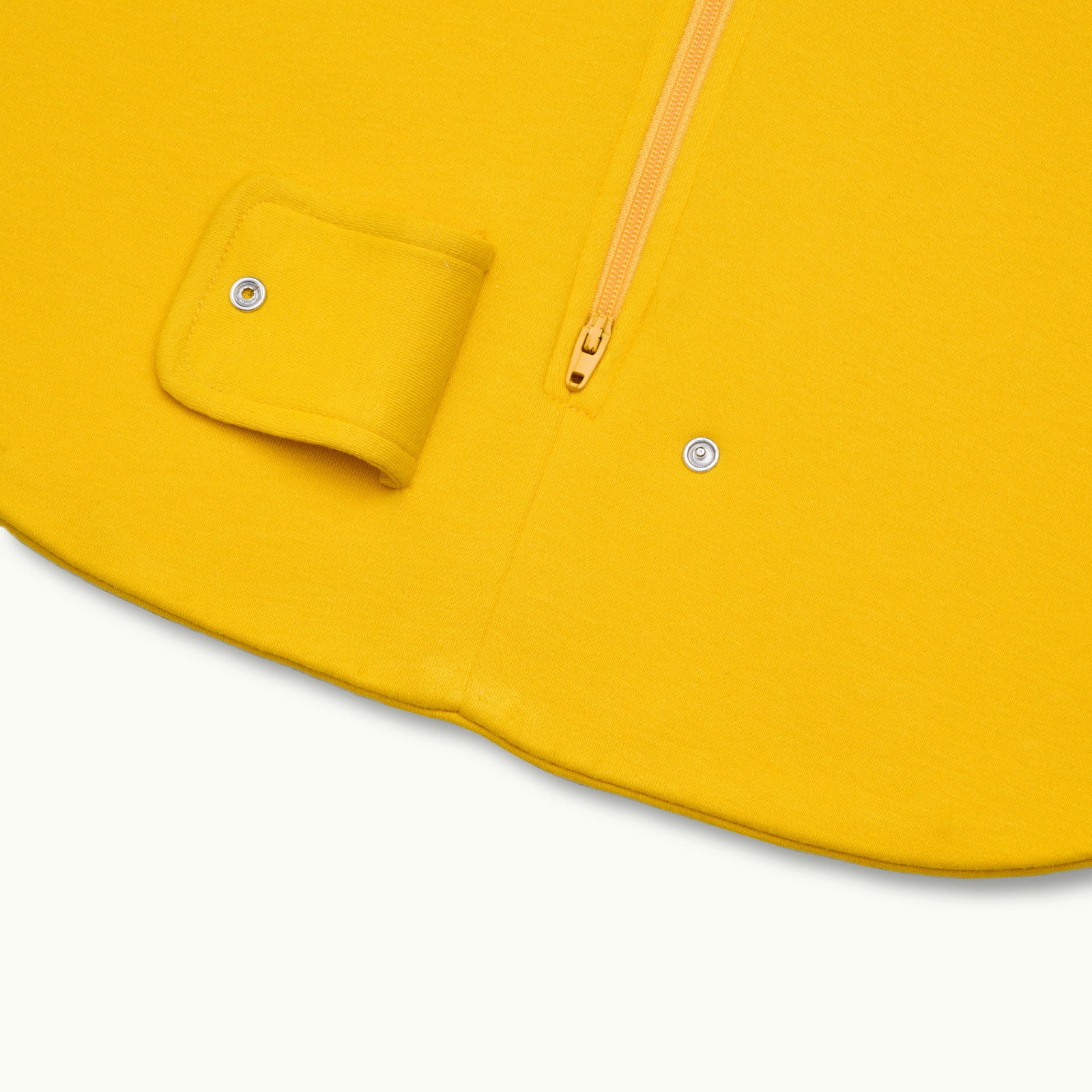 zoomed in on two-way bottom zipper on sleeping bag in marigold #color_marigold