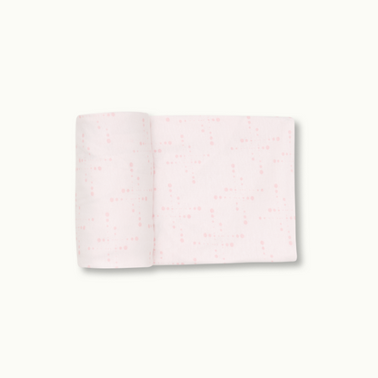 Nanit Knit Crib Sheet - Pink Sunburst Crib Sheet rolled 