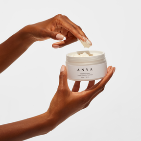 anya body butter lotion opened and applied on fingers