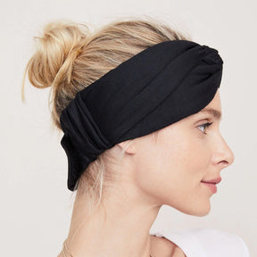Profile view of woman wearing HATCH Collection Head Peace on head