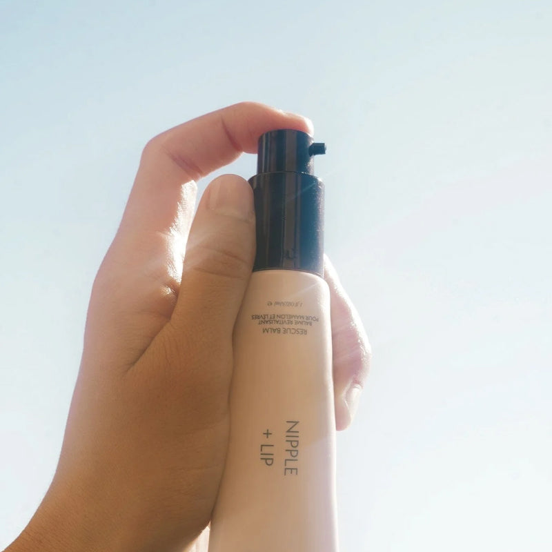 Pushing on HATCH Collection Nipple + Lip Rescue Balm's dispenser