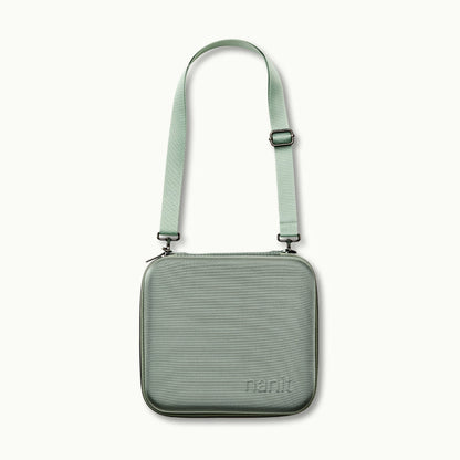 nanit traveling light case with shoulder strap in green oxford 
