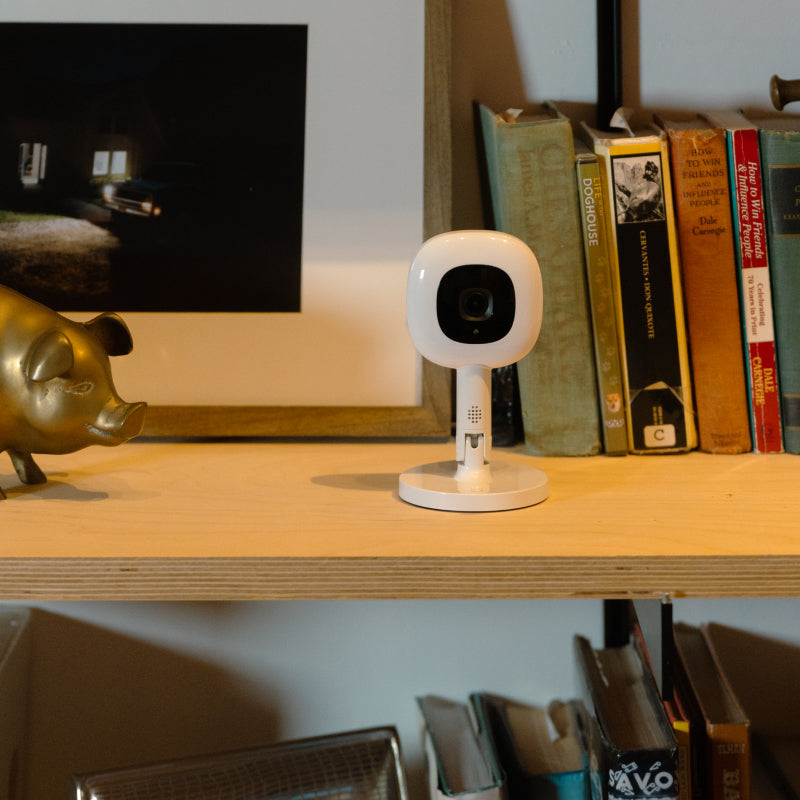 nanit pro camera + flex stand on top of book shelf