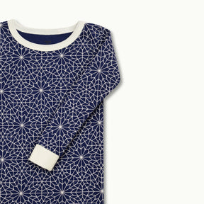 zoomed in on Nanit Two-Piece Sleep Wear Holiday Pajamas in Bright Star #color_bright star