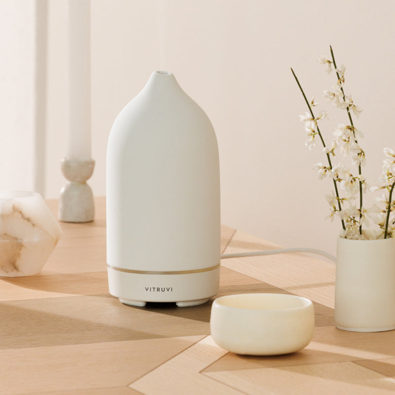 Vitruvi Stone Ceramic Diffuser on top of table